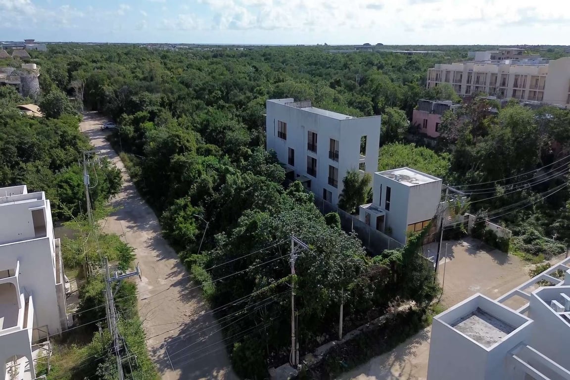 Tulum's Region 15 Corner Lot: Jungle Serenity with Coastal Access