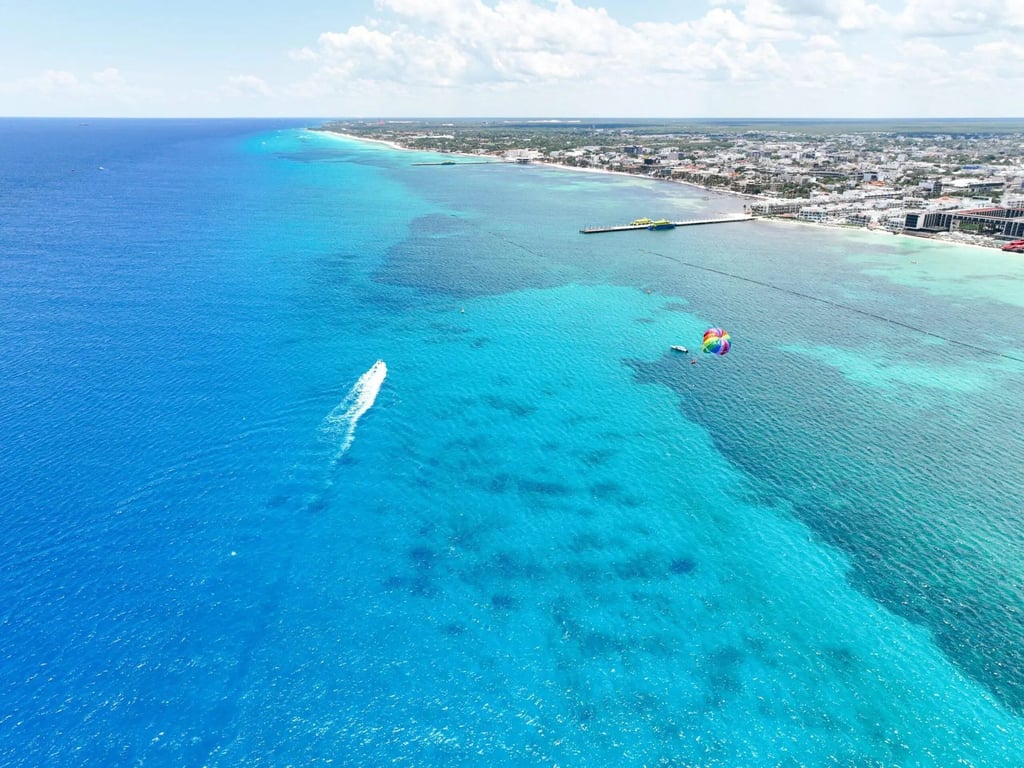 Turnkey Coco Beach Condo with Three Rooftop Pools and Sea Views