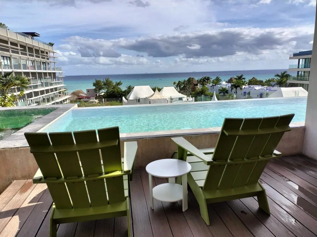 Architect-Customized Corner Condo with Caribbean Views in Coco Beach
