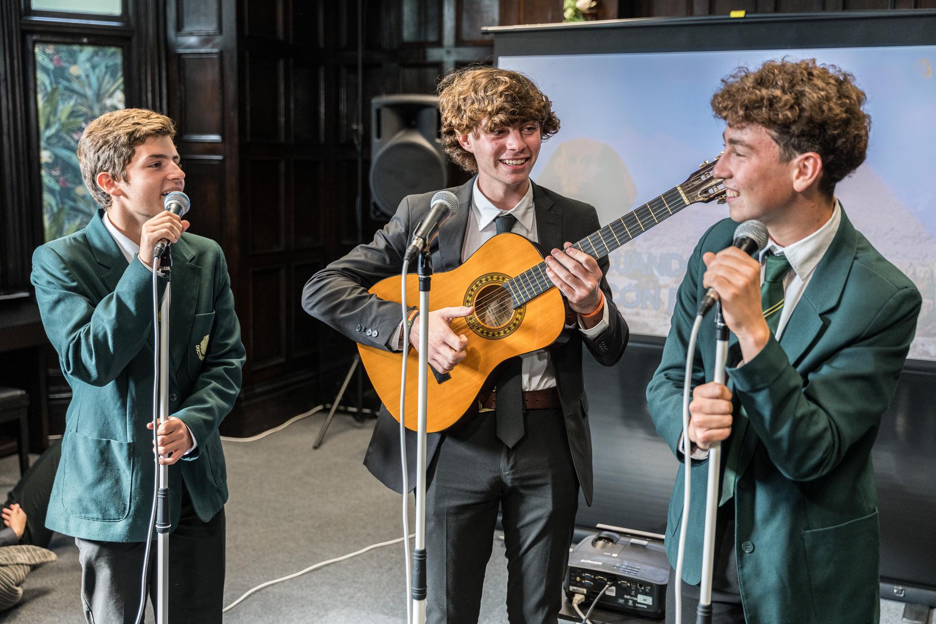 Pupils performing music on stage