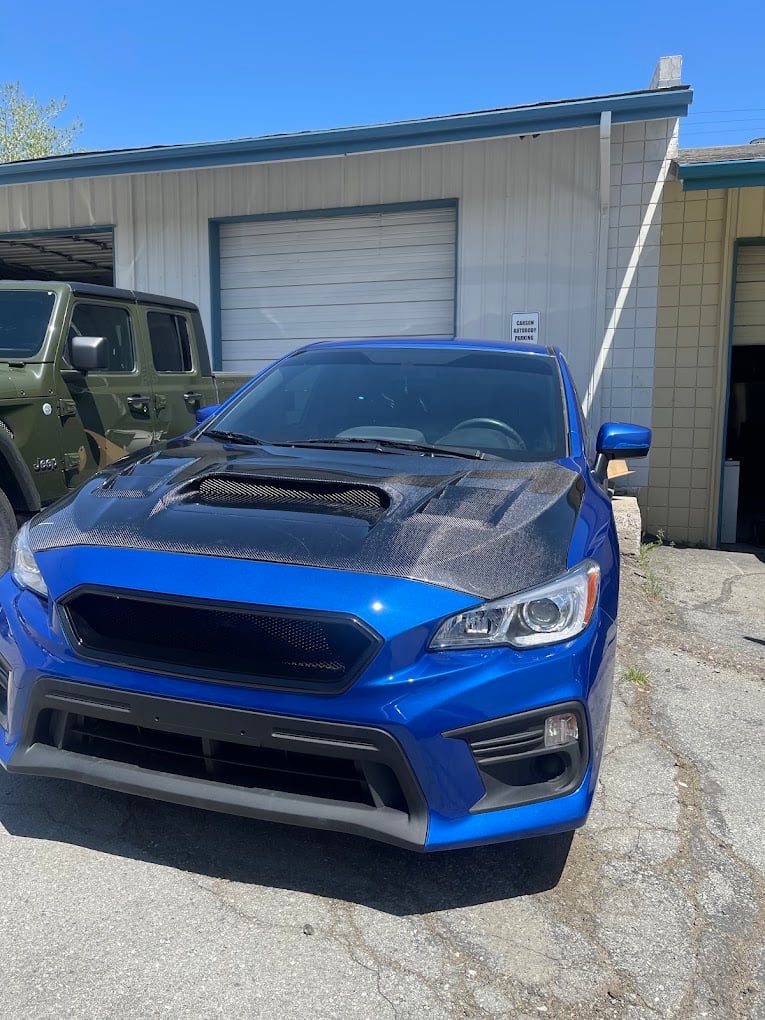Blue Car Clean In Front Of Shop at Carson Auto Body
