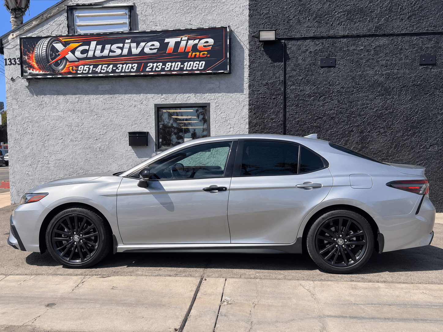 Customer vehicle at Xclusive Tire Inc for tire rotation service