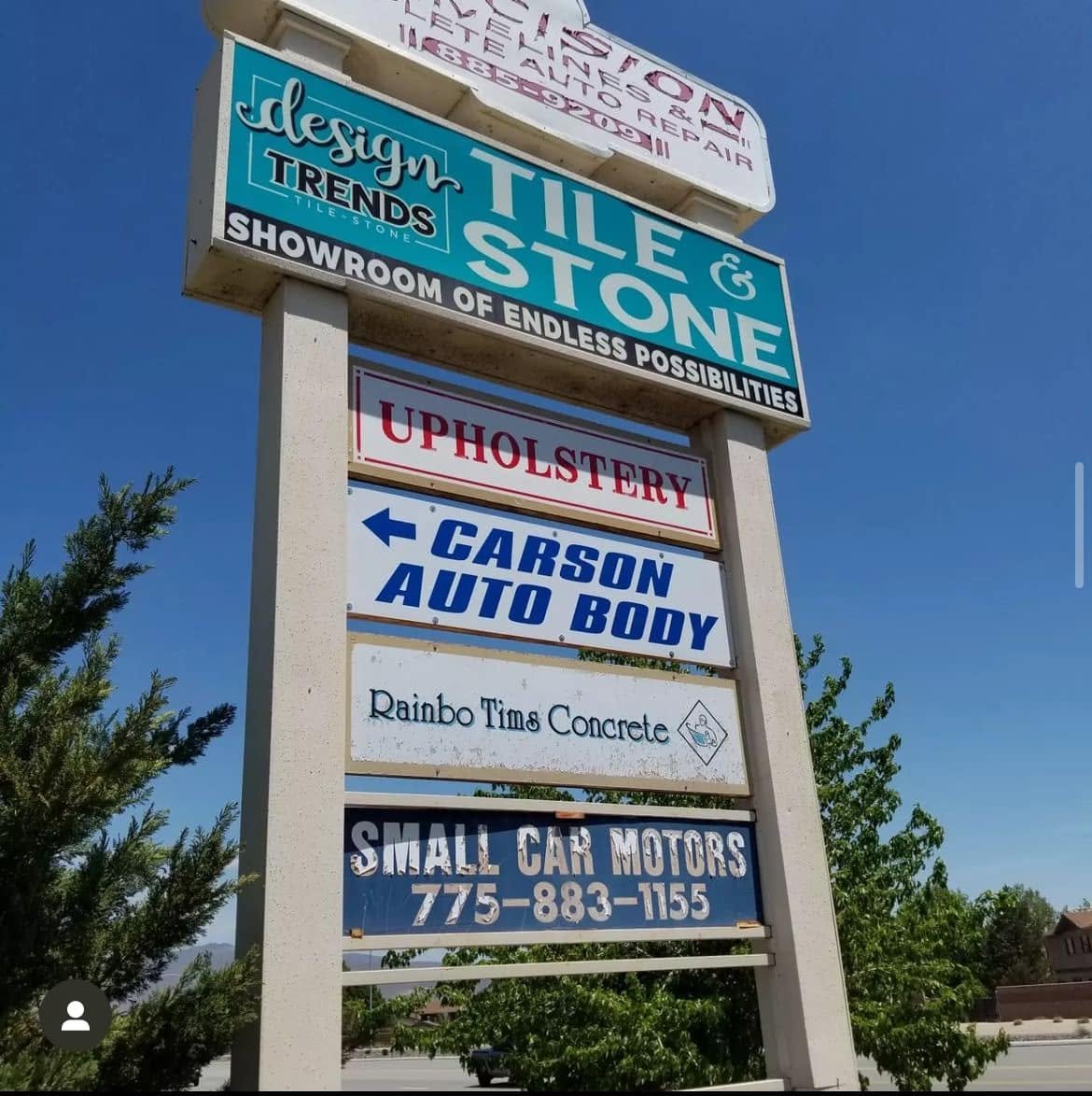 Sign Out Front Pointing To The Shop at Carson Auto Body