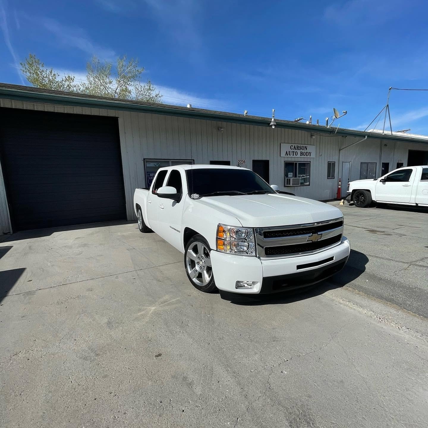 Clean White Truck In Front at Carson Auto Body