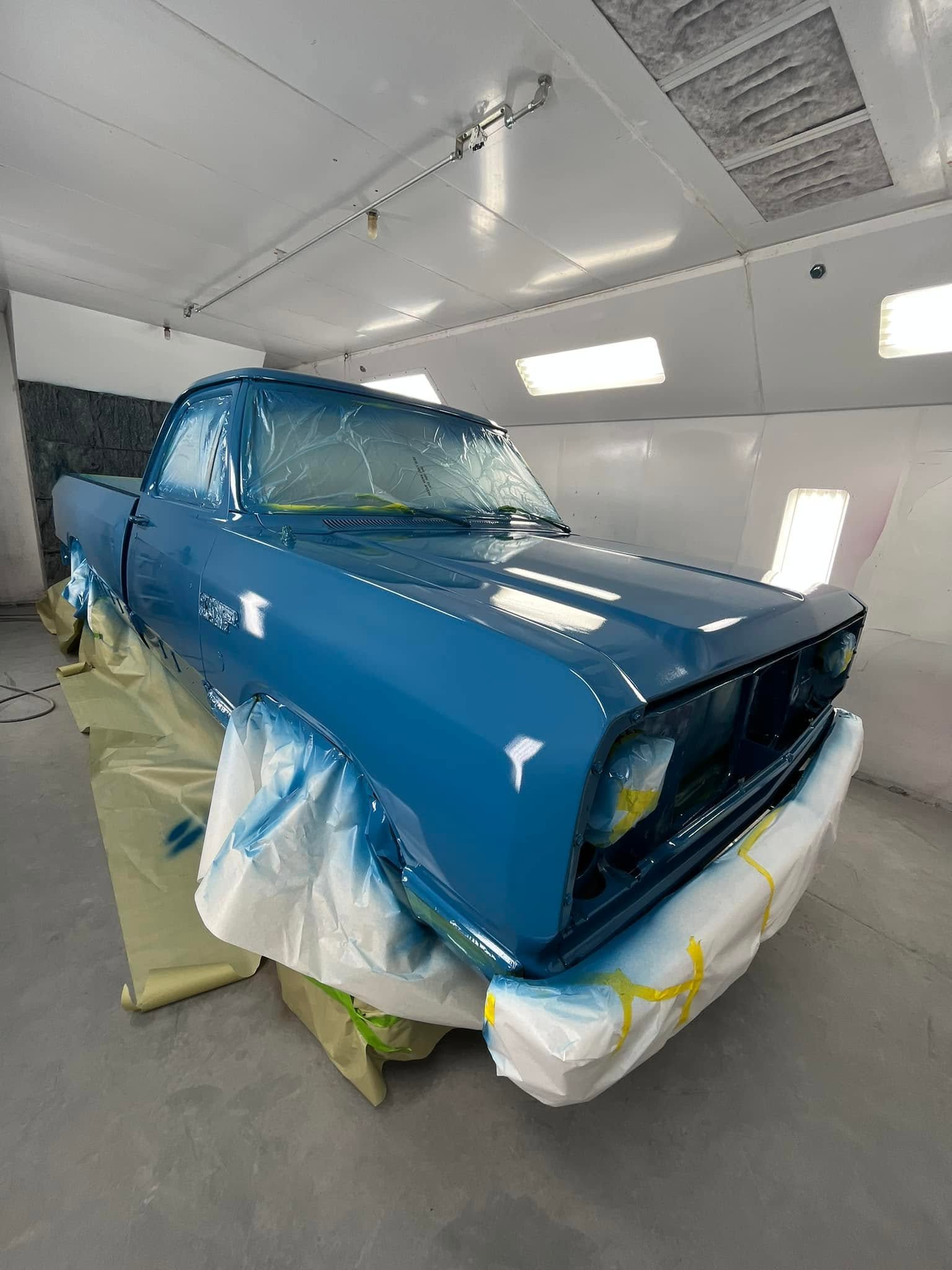 Vehicle being refinished in the paint process