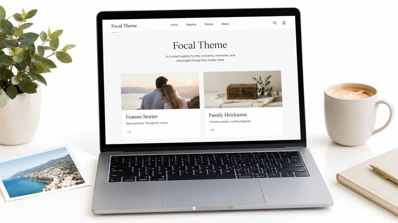 A modern laptop displaying a Focal Theme website design on a white desk with plants and coffee.