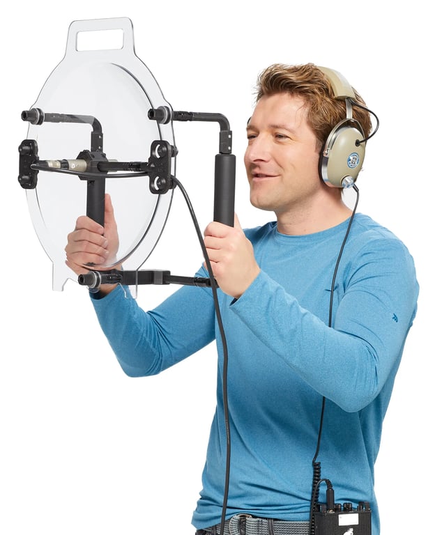 A man holding a KLOVER MiK 16 parabolic microphone