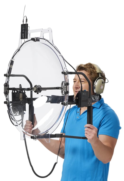 A man holding a KLOVER MiK 26 parabolic microphone
