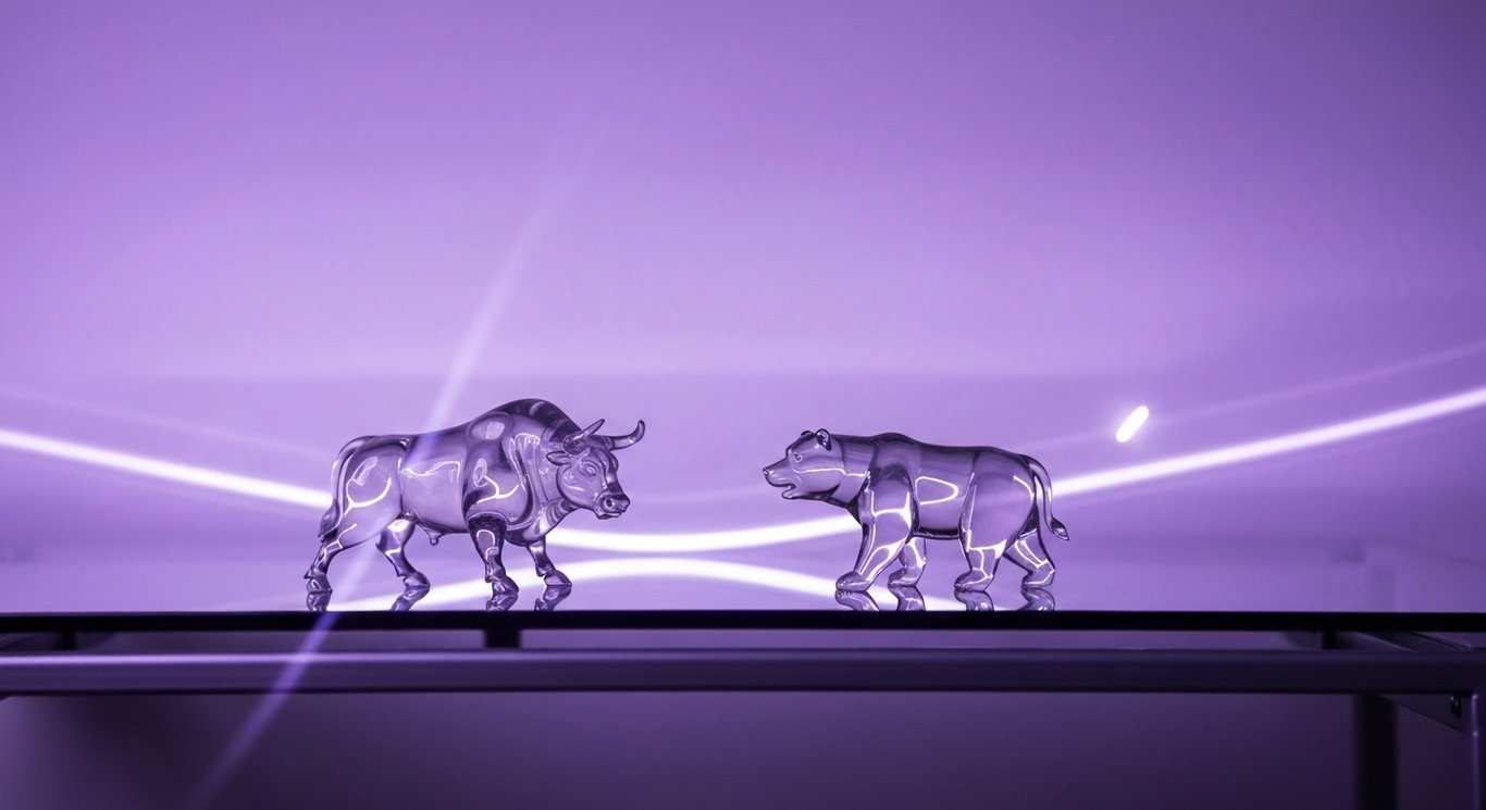 Bull and bear figurines on a sleek glass desk with soft purple gradient background