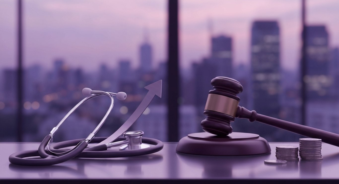 Stethoscope beside gavel, coin stack, and upward arrow on glass desk against soft purple gradient background