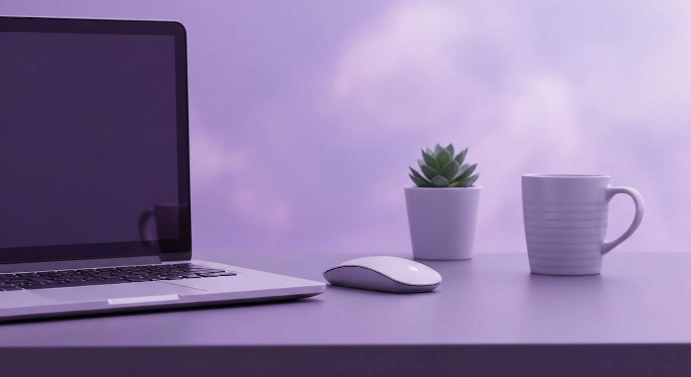 Laptop on tidy desk with mouse and mug, soft purple gradient background