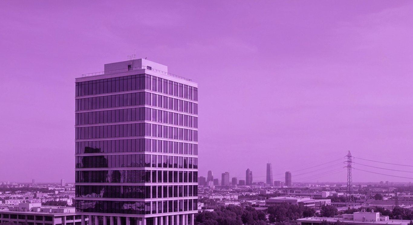 Modern office building with cityscape featuring energy and defense infrastructure in the background