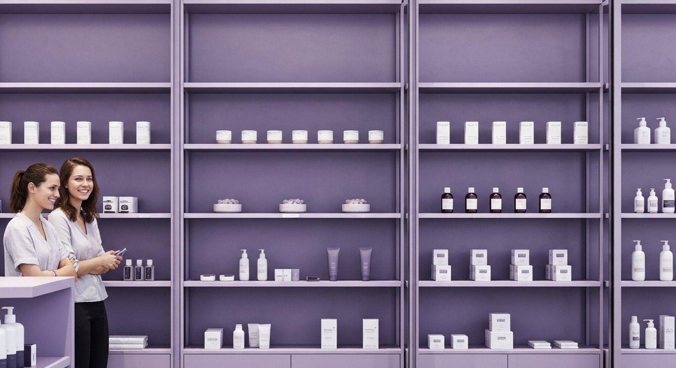 Retail storefront with organized shelves and shoppers, set against a soft purple minimalist background