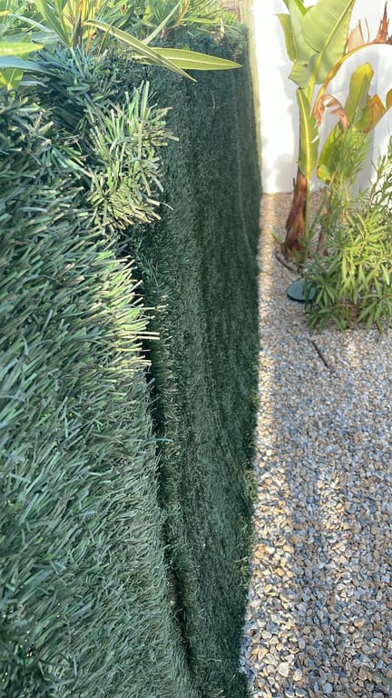 Artificial hedge cleared of plant shoots
