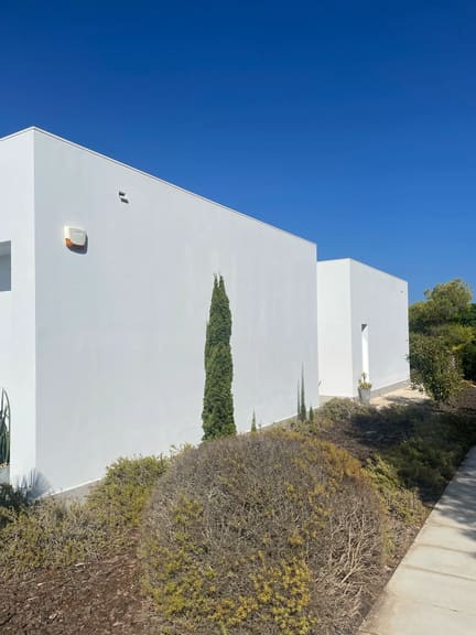Exterior wall cleaned, bright and white