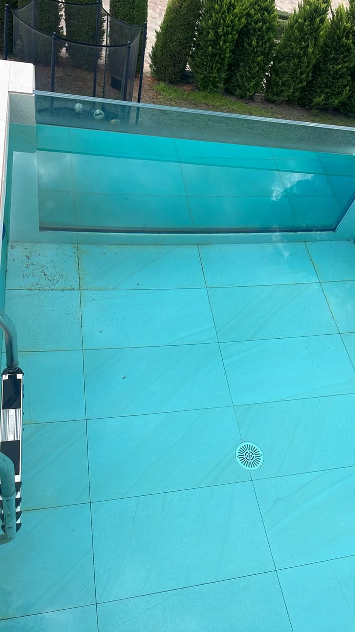 Before: Pool floor dirty with debris