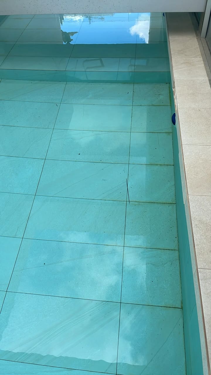 Before: Pool floor dirty with debris