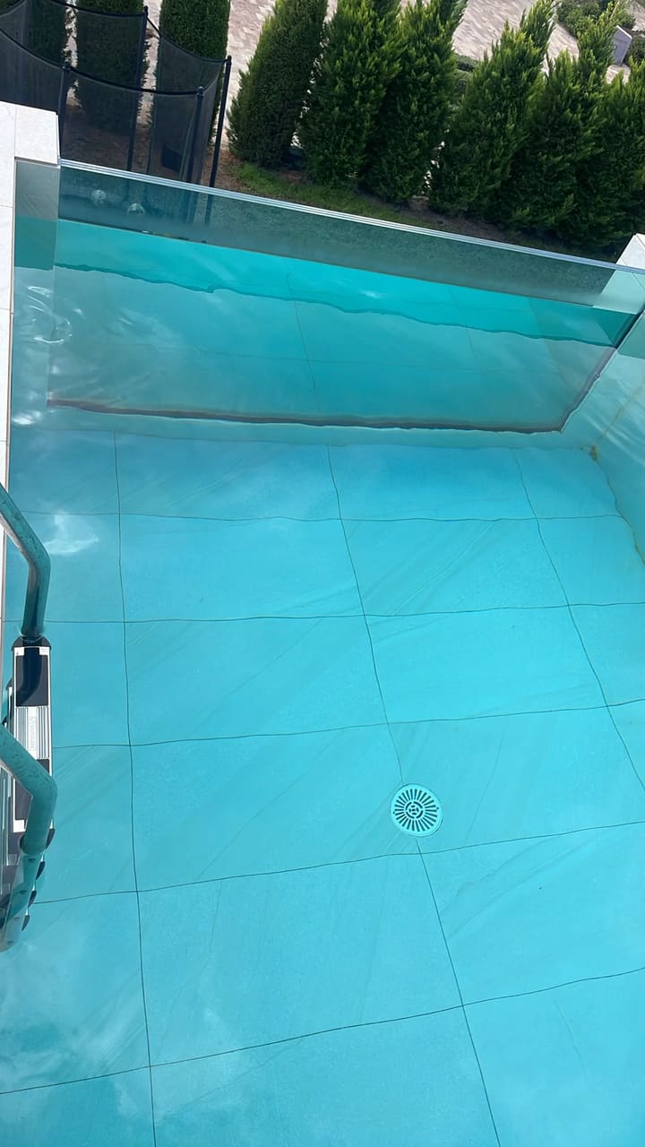 After: Pool floor cleaned, water crystal clear