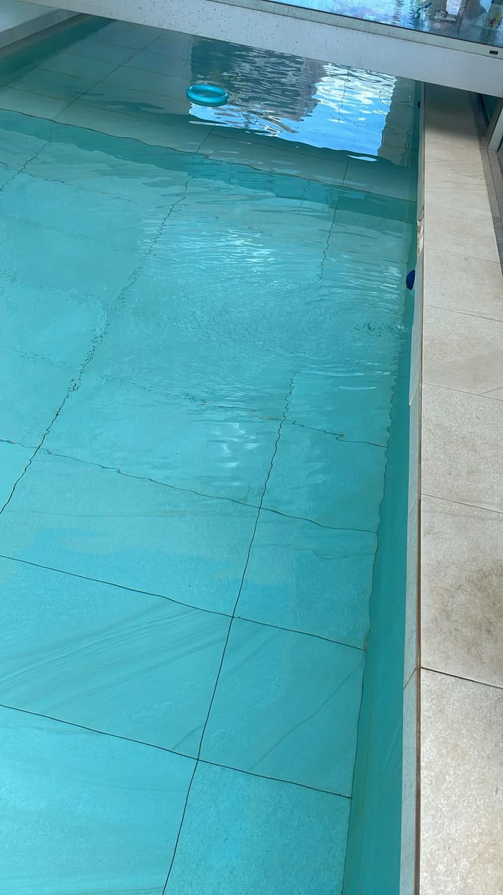 After: Pool floor cleaned, water crystal clear