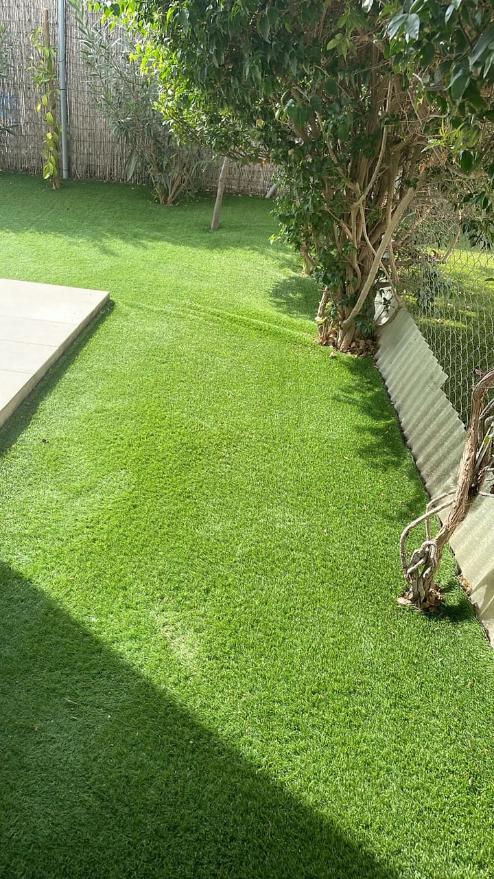 After: Artificial grass cleared of leaves and debris