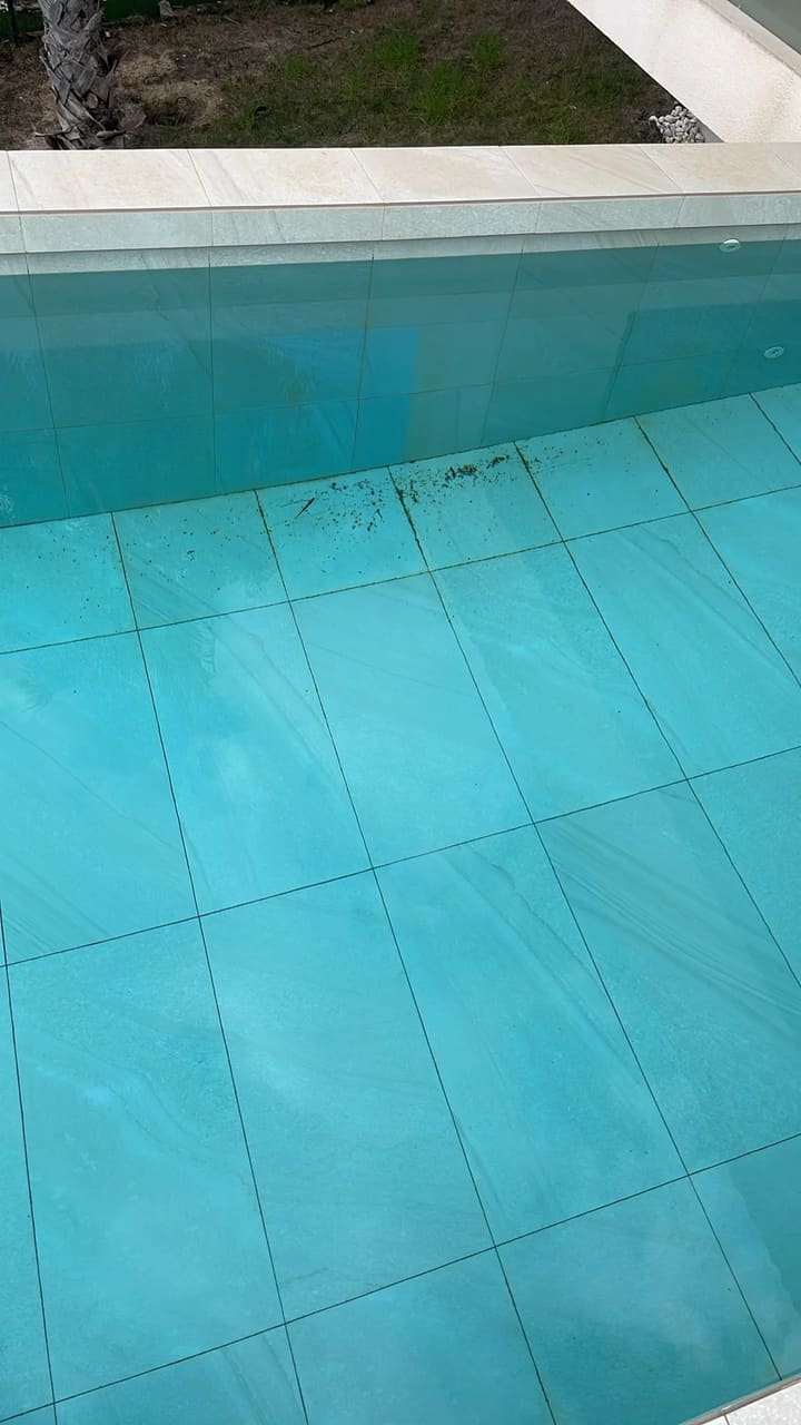 Before: Pool floor dirty with debris