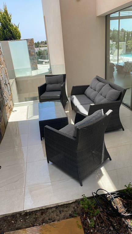 Patio furniture arranged, area cleaned