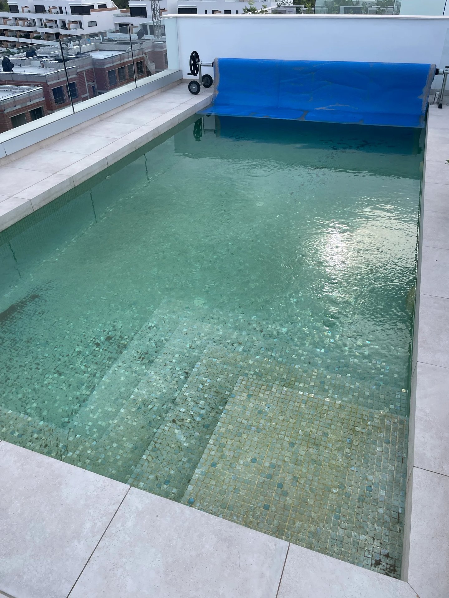 Pool water cloudy, floor dirty with sediment