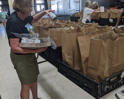 Volunteers Filling Bags with Groceries