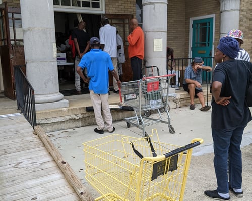 Those without cars walking up to get personalized selections of groceries