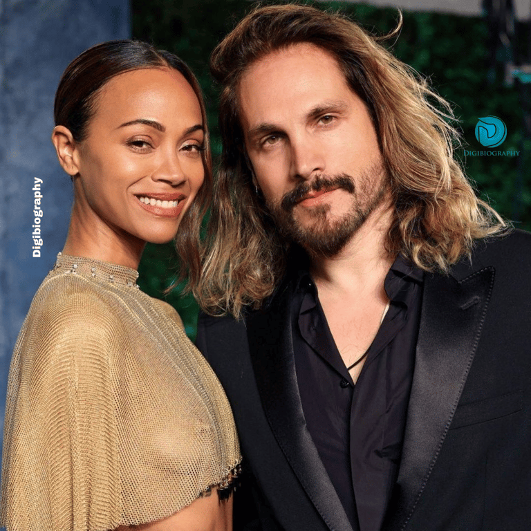 Zoe Saldana stands with her husband Marco Perego