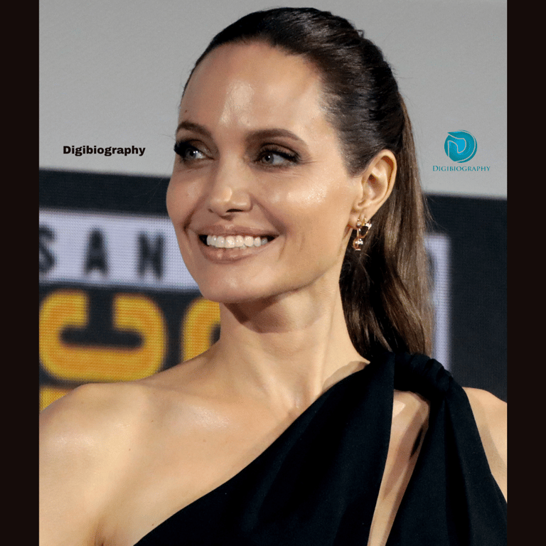 Angelina wearing a black dress and gives a side look
