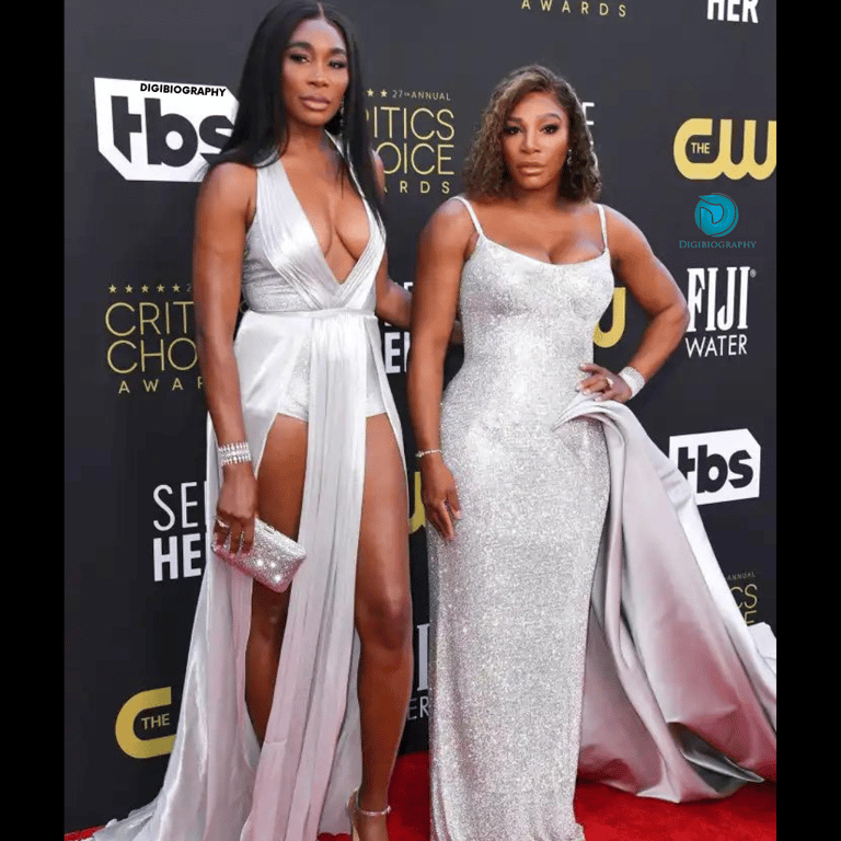 Serena Williams stands with her sister Venus Williams