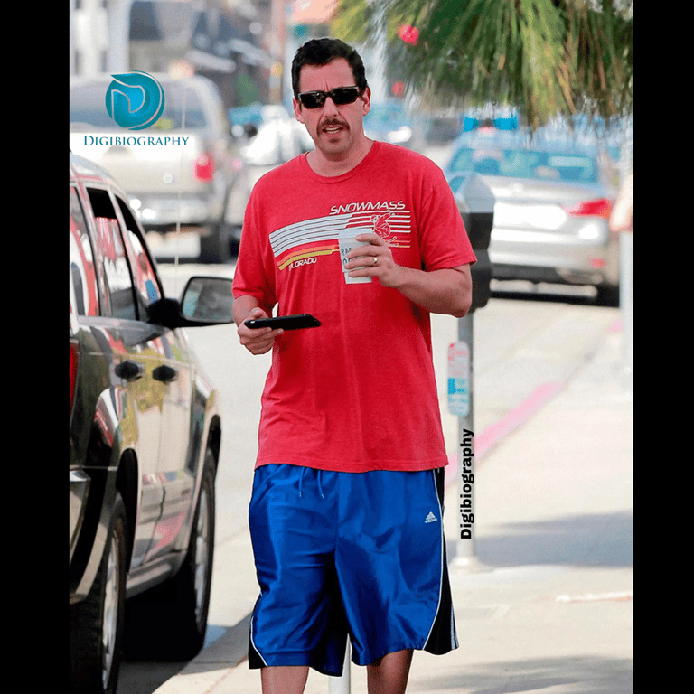 Adam Sandler was spotted while walking on the street and holding a drink in his hand