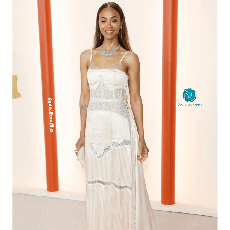 Zoe Saldana wearing a white dress and stand on the floor