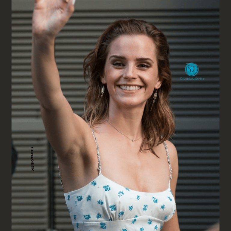 Emma Watson says hello to her fans and wears a white dress