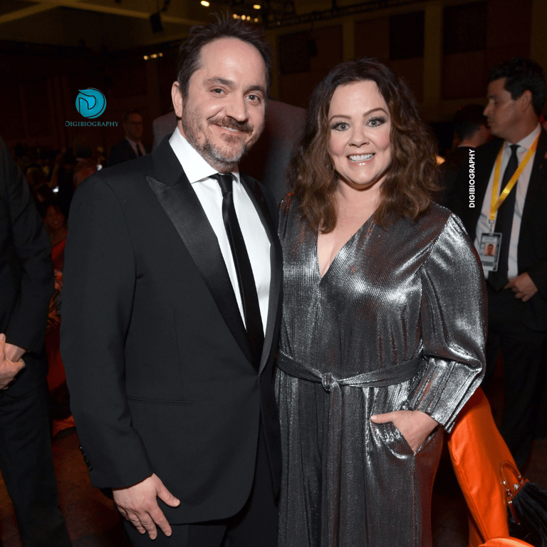 Melissa McCarthy stands with her husband Ben Falcone