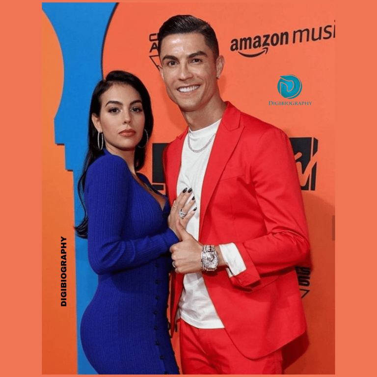 Cristiano Ronaldo stands with her girlfriend Irina Shayk while wearing a red coat with a white t-shirt