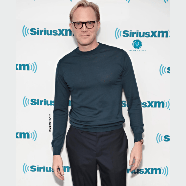 Paul Bettany wearing a green full slive t-shirt and black pant