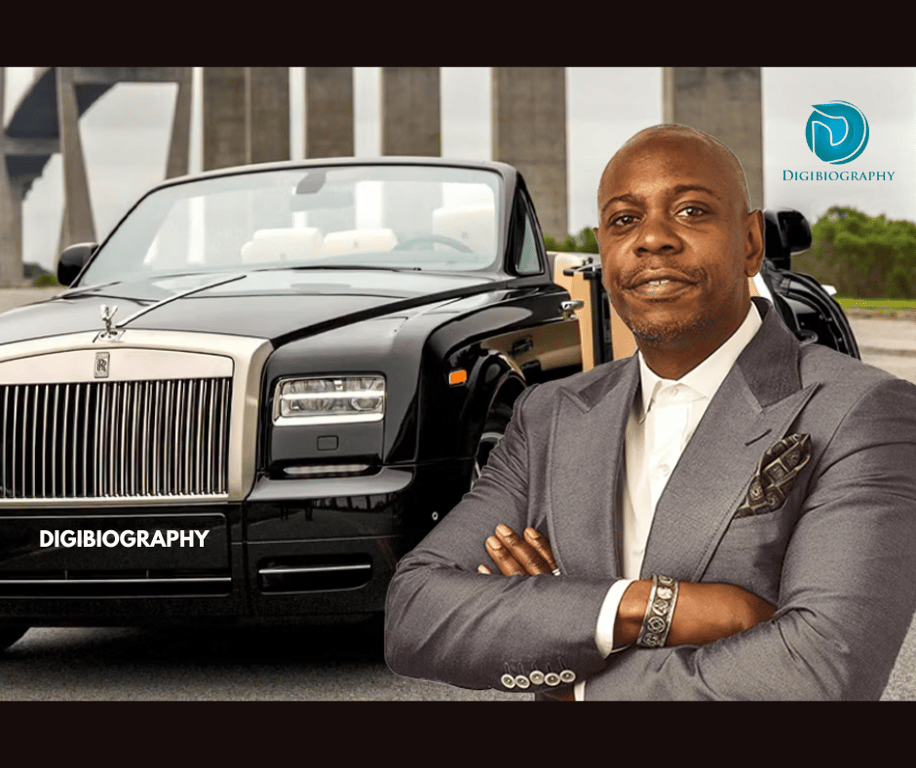 Dave Chappelle next to her Rolls-Royce car
