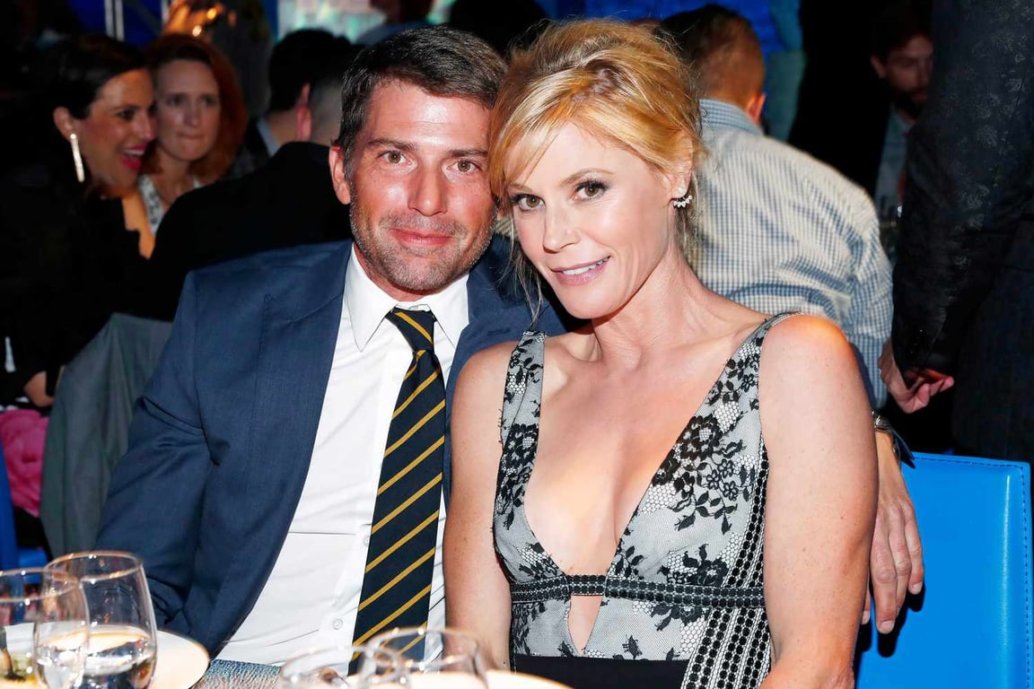 Julie Bowen sitting with her husband Scott Phillips