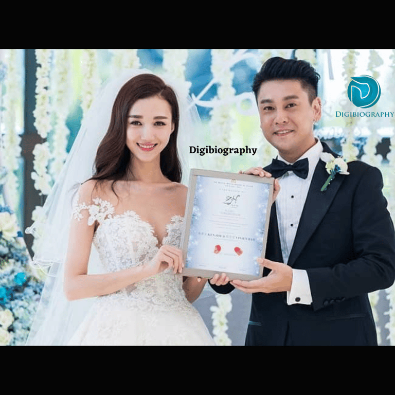 Wenwen Han's wedding photo with the husband and both are in wedding dresses and holding a certificate