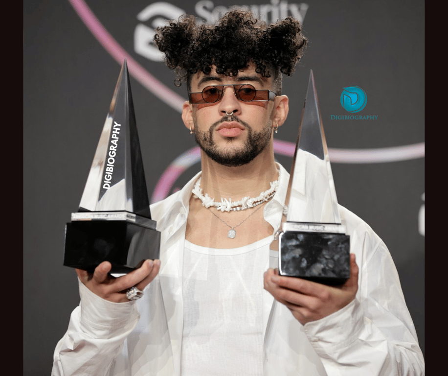 Bad Bunny attends an award faction and wears a white shirt