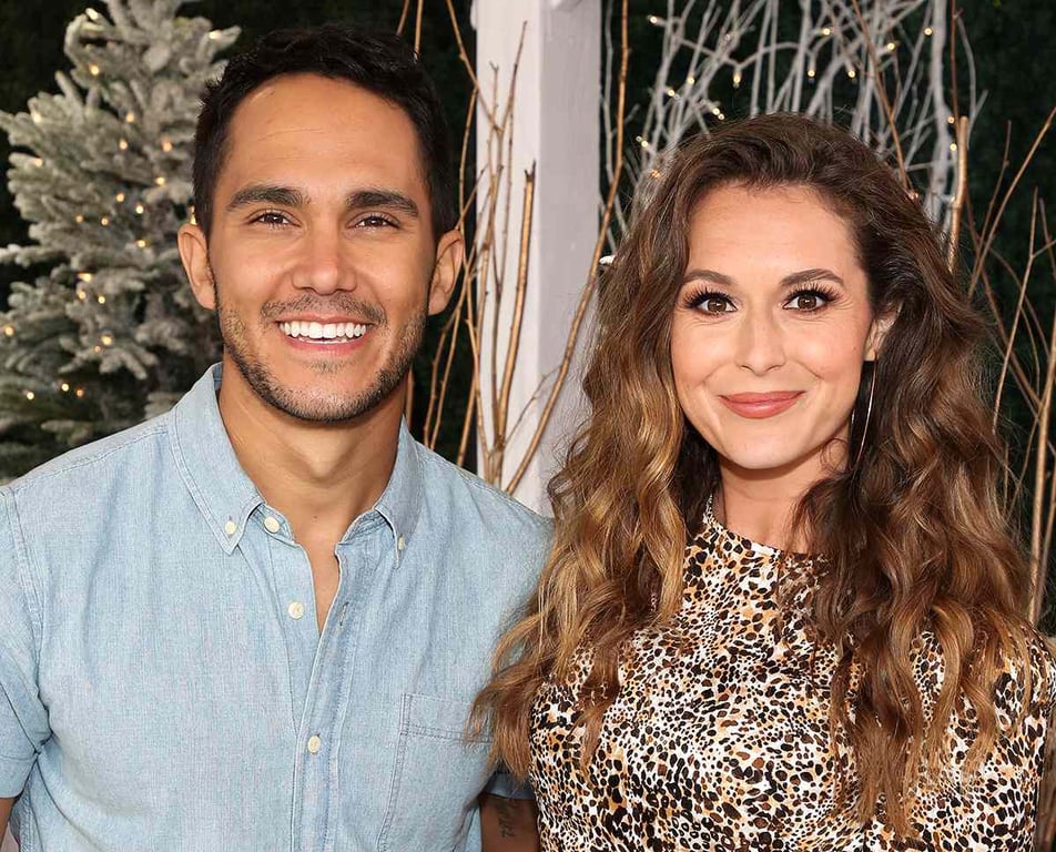 Carlos PenaVega stands with the wife in the function