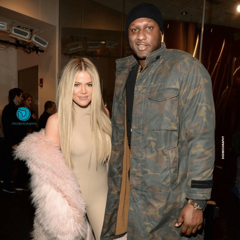 Khloe Kardashian stands with her husband Lamar Odom