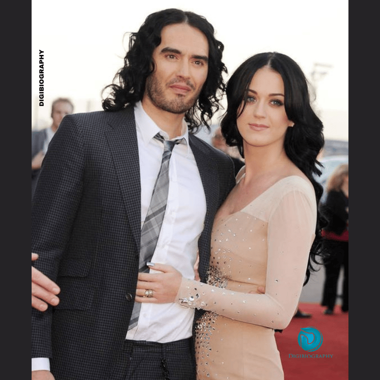 Katy Perry stands with her husband Russell Brand