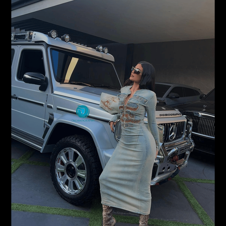 Kylie Jenner stands with her Mercedes car