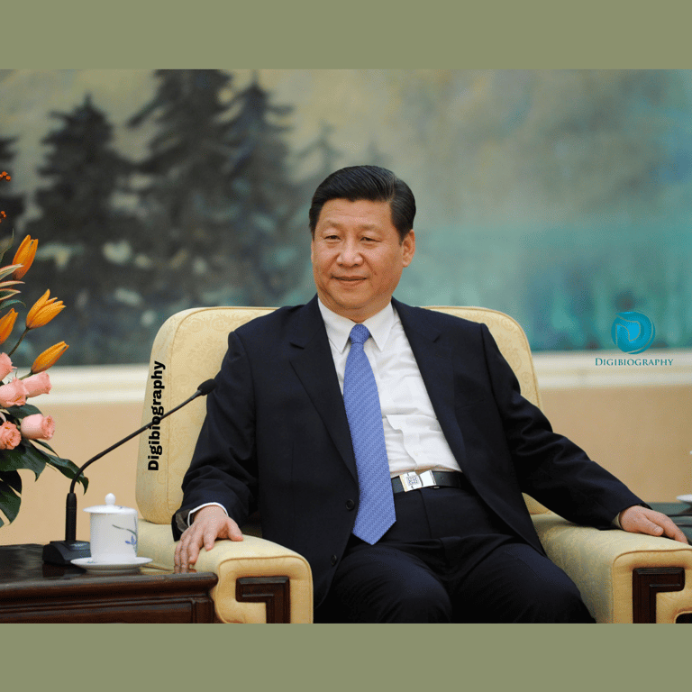 Xi Jinping wears a black suit sits on the sofa and gives an interview