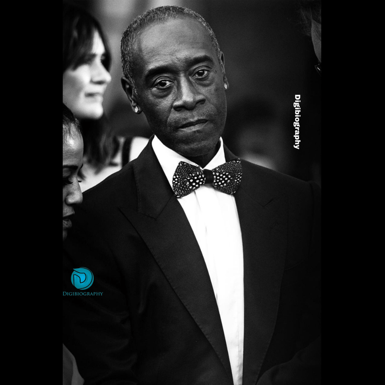 Don Cheadle wears black suit in the function