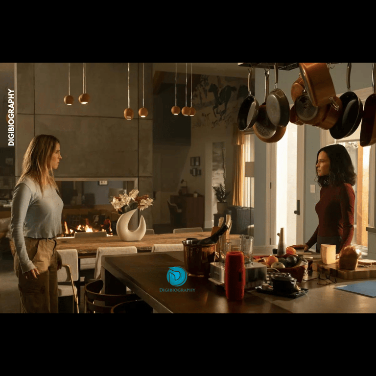 Betty Gilpin standing in the kitchen and something discus with her co-actor