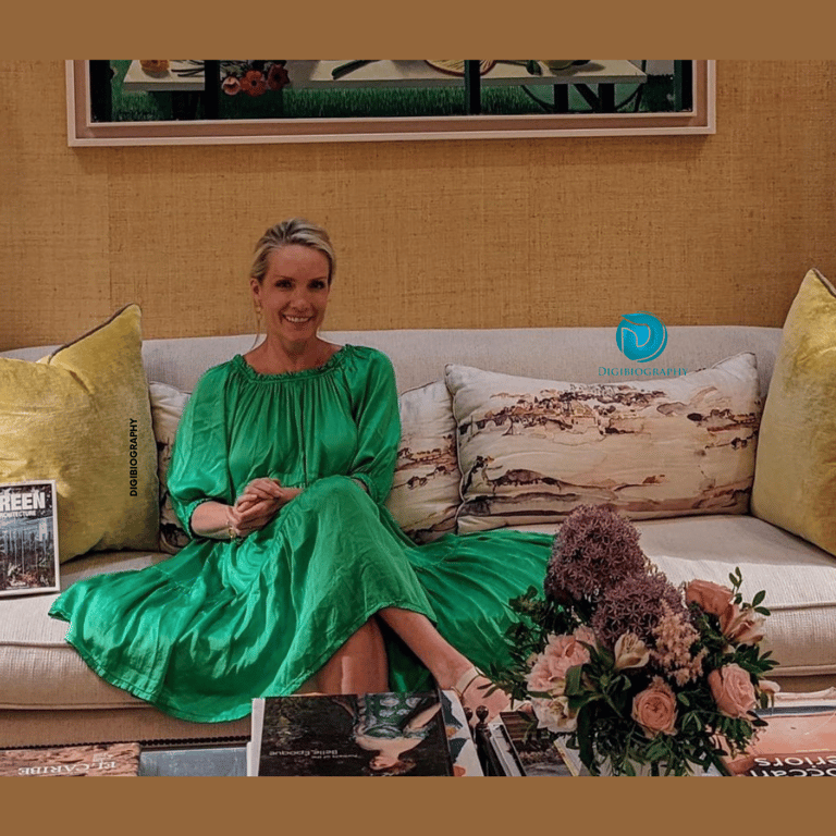 Dana wearing a green dress while sitting on the sofa